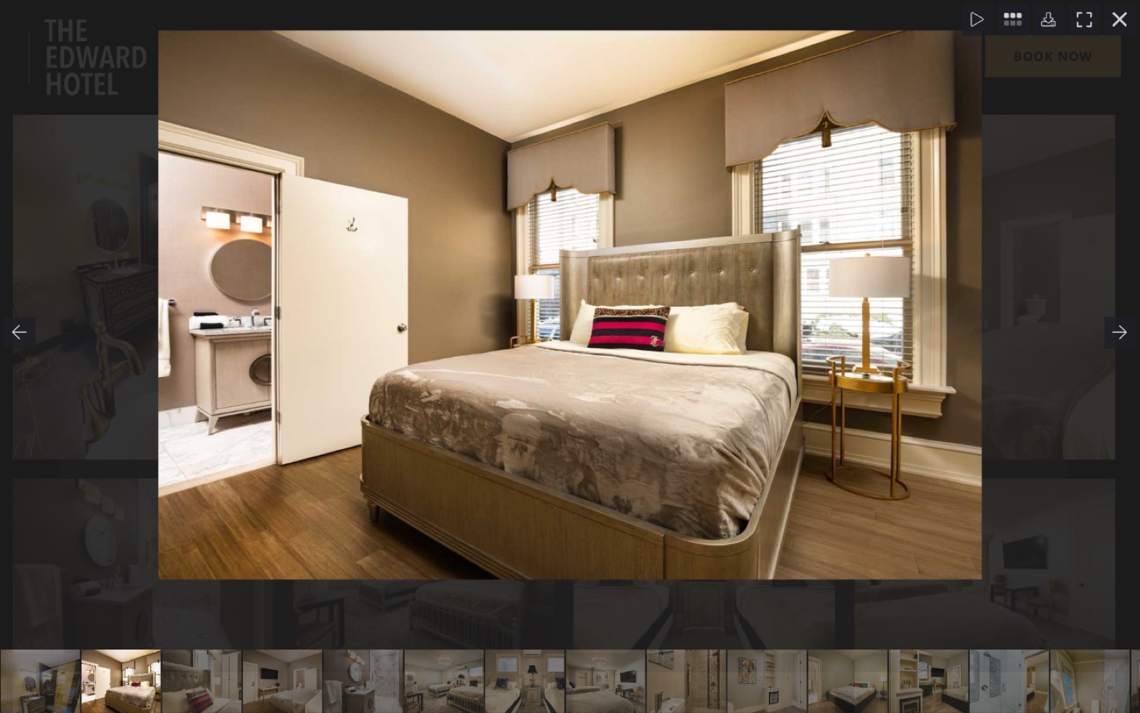 Gallery lightbox with a full-size room photo, filmstrip of thumbnails, and slideshow controls